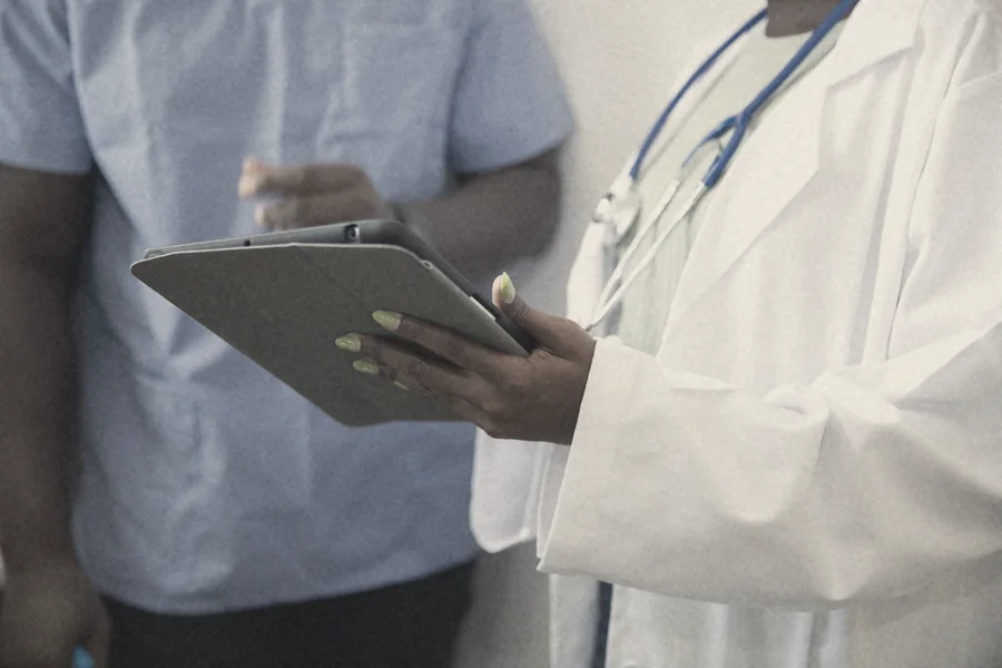 A clinician using a tablet
