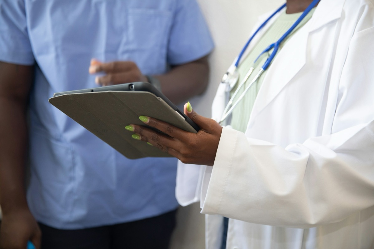 A clinician using a tablet