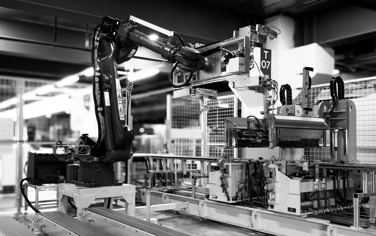 An industrial robot arm on a production line