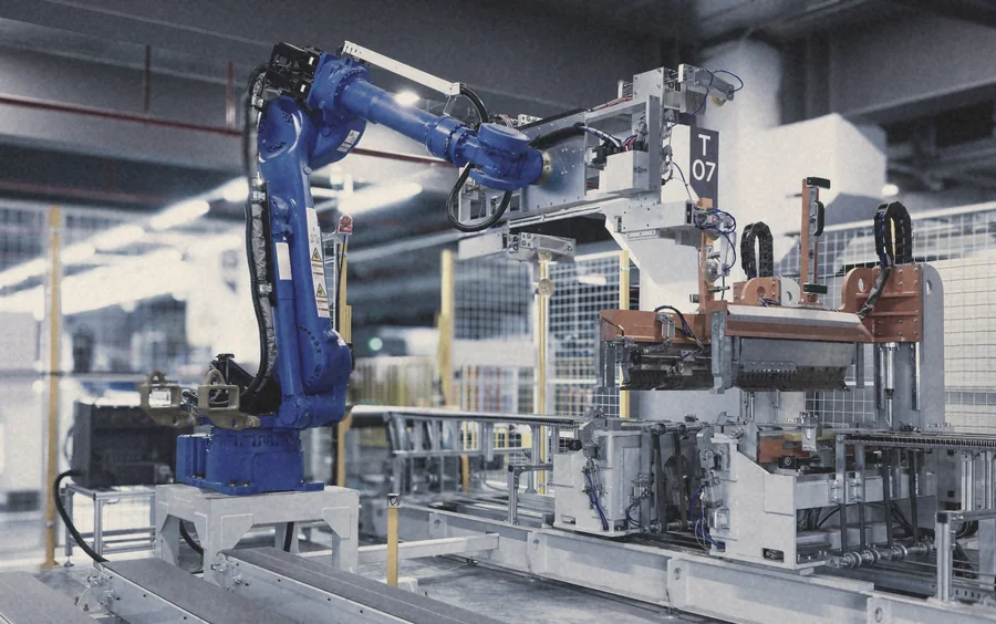 An industrial robot arm on a production line