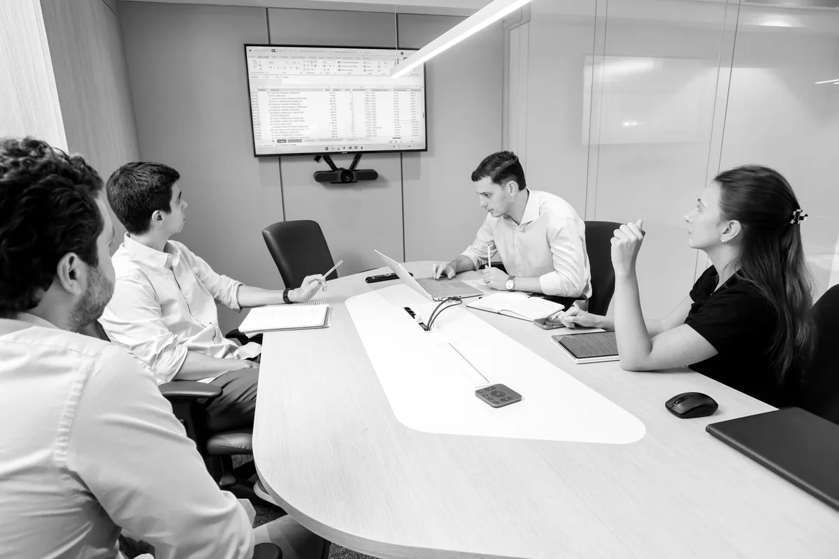 Leadership team in a meeting around a conference table