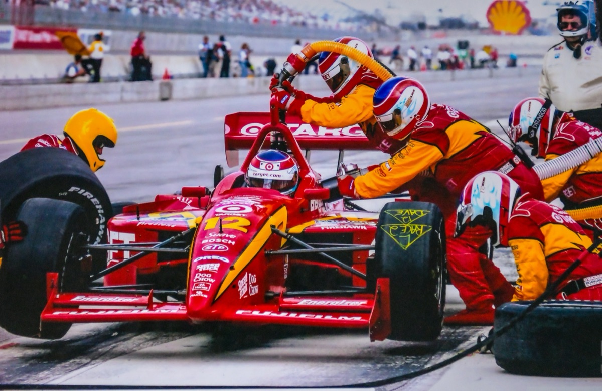 Pit crew changing tyres during a race