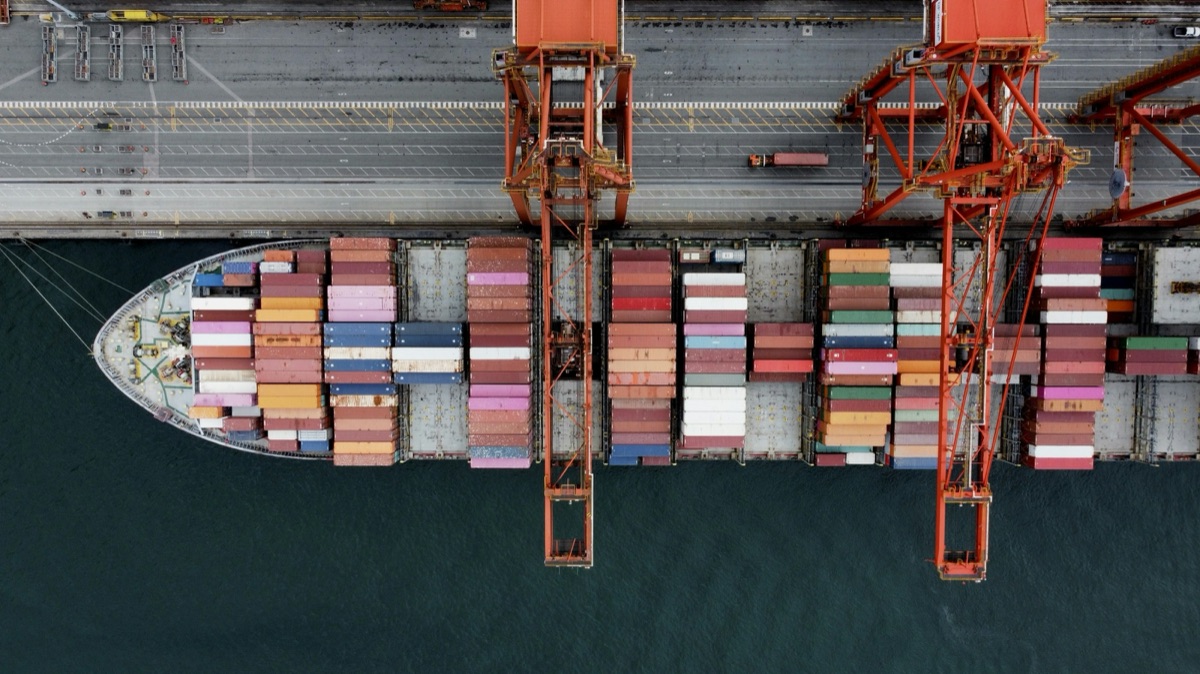Container ship loaded at port, seen from above